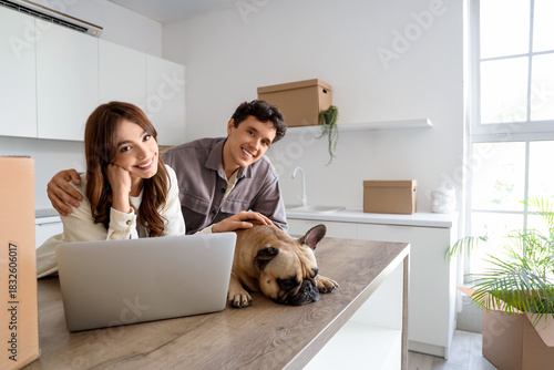 Young couple with dog and l...