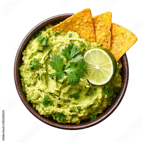 Fresh guacamole in a bowl with tortilla chip and lime 