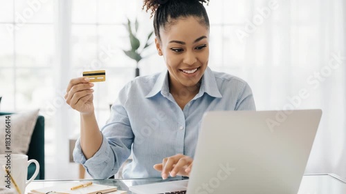 Cheerful Black Woman Making Online Payment with Credit Card