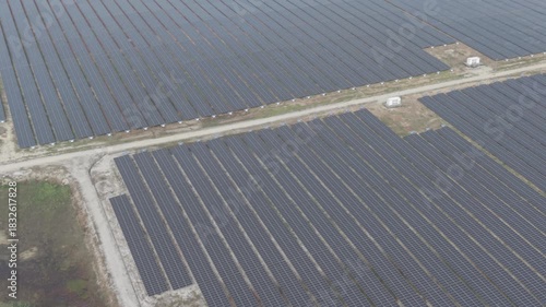 Aerial view of solar panel farm on the hill. Green renewable energy resources. Future of sustainable energy generation. Zero pollution concept.