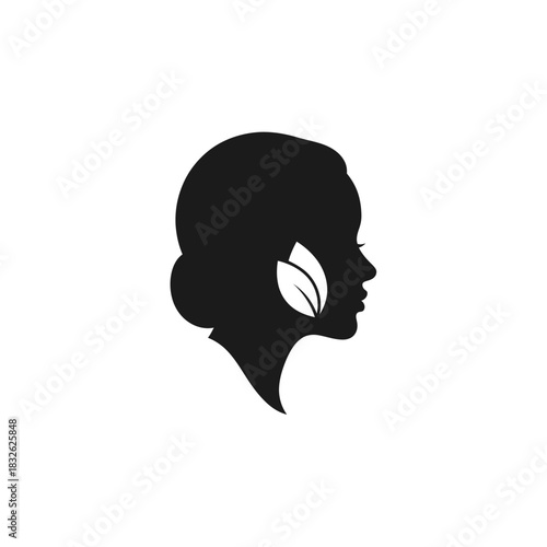 Silhouette of a woman's profile with a leaf integrated into the hairstyle