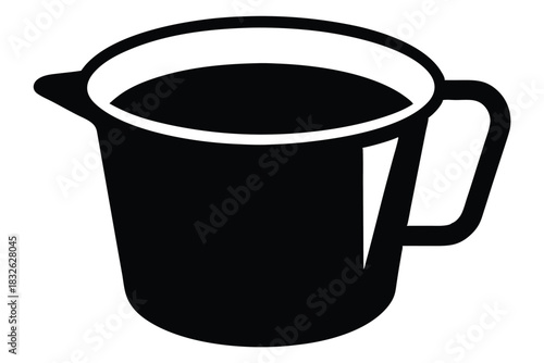 An isolated black pitcher is shown partially filled with liquid on white background