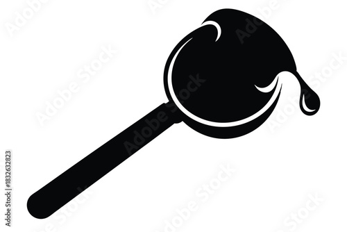 Thick dark fluid clings to a stylized spoon with a single drip