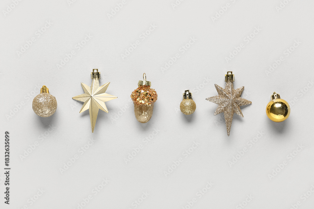 Naklejka premium Beautiful composition with golden Christmas balls on white background