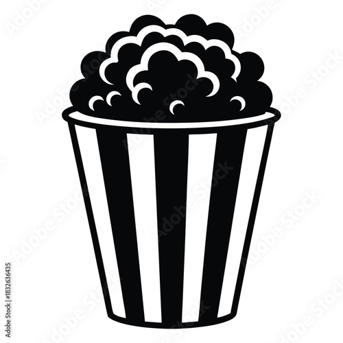 A black and white popcorn bucket overflows, offering a simple yet classic treat
