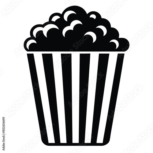 Black and white popcorn in a striped container is ready for watching movies