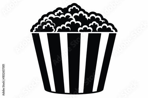 Simple silhouette shows tasty popcorn overflowing from a striped container in black and white