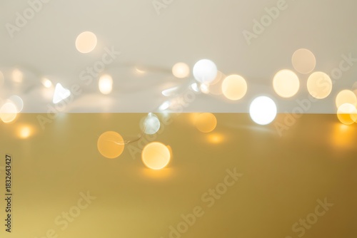 Warm glowing string lights create a festive and elegant ambiance on gold background perfect for holiday promotions and seasonal designs adding a touch of magic