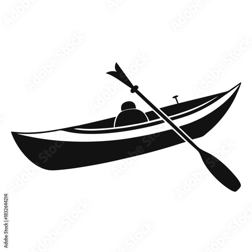 A black simple canoe floats quietly with a lone occupant paddling gently forward