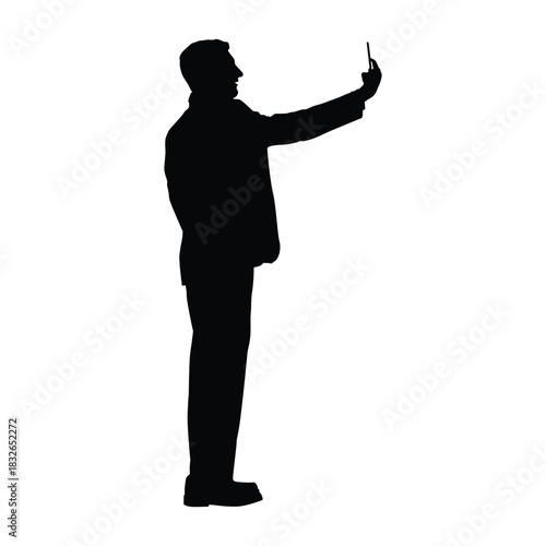 Man Silhouette in Formal Attire Taking a Selfie with a Smartphone. Concept of Social Media, Modern Communication, and Self-Branding.