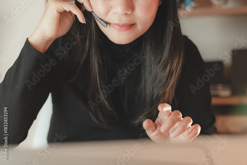 Close up of woman wearing headset microphone for customer service support or telecommunication. Concept of online communication, call center, remote work, business service, and consulting