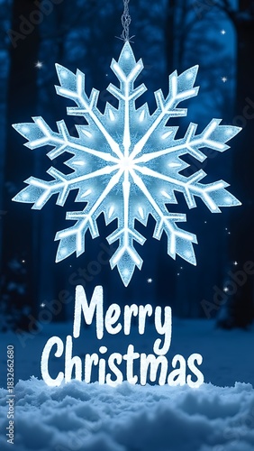 Merry Christmas snowflake ornament hanging on blue winter background with festive greeting text and sparkling snow decoration