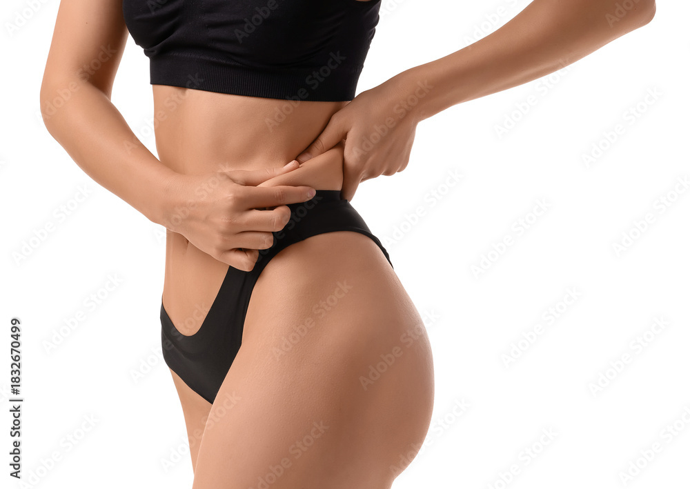 Fototapeta premium Young woman in underwear on white background. Liposuction concept