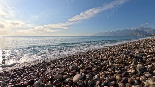 beautiful sandy beach with calm sea waves on a sunny day (with wave sounds)