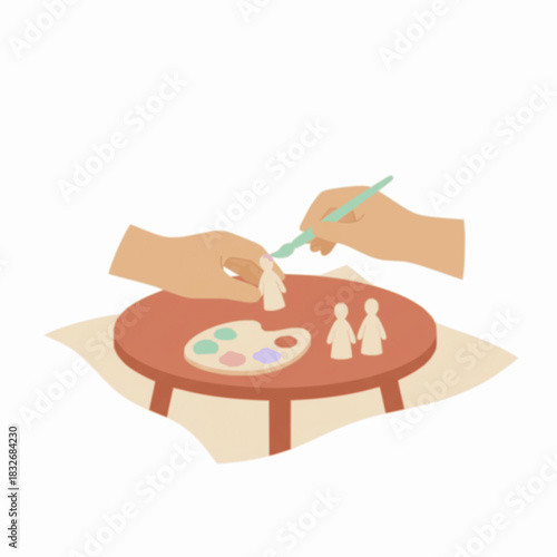 Painting tiny wooden figures at the table