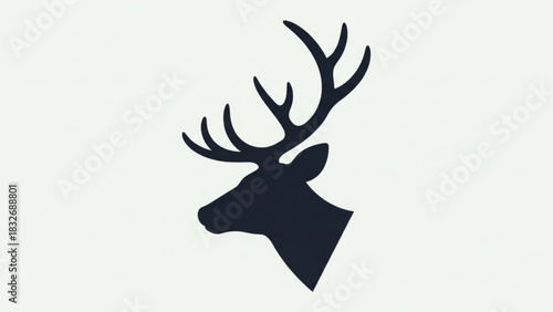 Elegant dark silhouette of a majestic stag head with impressive antlers isolated against a clean white background symbolizing nature and wildlife