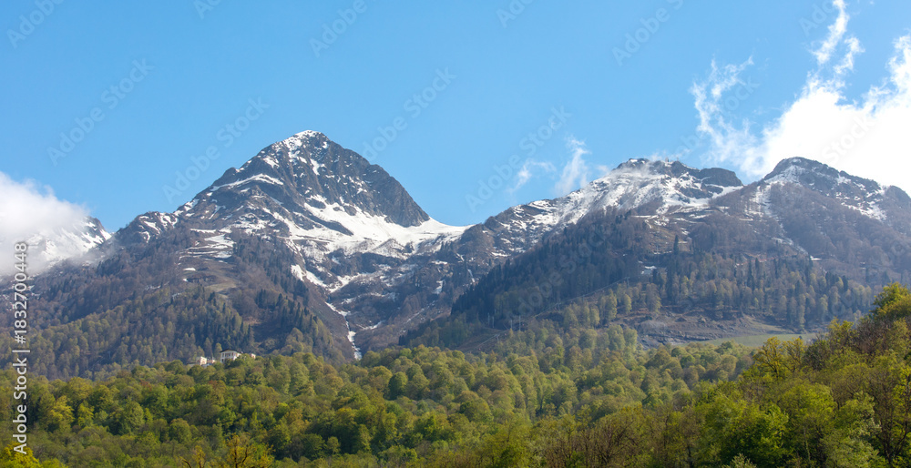 Fototapeta premium The mountains are covered in snow and the sky is clear