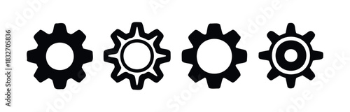 Set of four black gears with circular openings in the center, representing mechanisms and engineering, suitable for technology and industrial concepts.