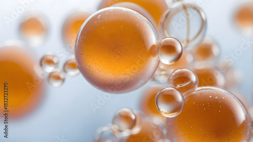 Macro Shot of Orange Oil Droplets in Water – Abstract Fluid Dynamics, Artistic Bubbles Texture, Bright Liquid Gradient Background for Science and Skincare Concepts
