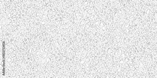 Monochrome pebble pattern background with soft shadows and subtle texture