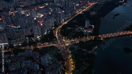 Aerial Timelapse of Traffic Light Trails at a Busy Intersection in Nanning, China at Night