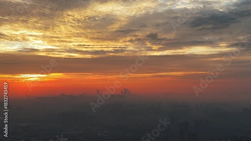 Panoramic Aerial Timelapse of a Golden Sun Rising Within a Vast Canopy of Morning Clouds