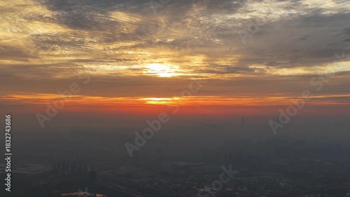 The Sun King's Arrival: A Dramatic Chinese Cityscape Backlit by a Full Golden Sky at Dawn