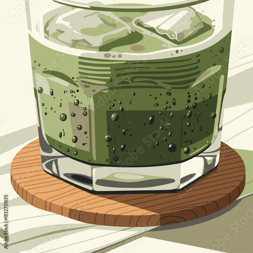 An invigorating green iced drink in a faceted glass, complete with condensation and a stylish wooden coaster, offers a cool and healthy refreshment.