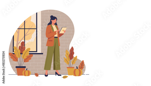 Stylish woman using a digital tablet in an autumnal office focusing on remote work and technology