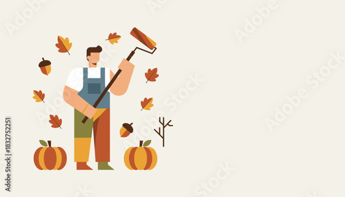 Professional painter holding a roller surrounded by autumn decorations leaves and pumpkins Home repair concept