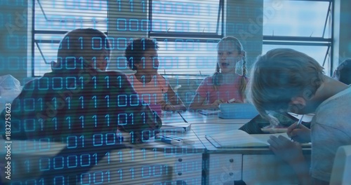 Sitting group of four kids wearing shirts, discussing tablet at class table with binary overlay