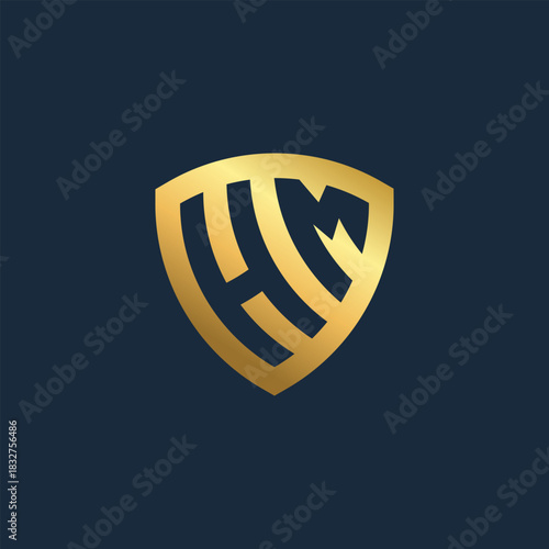 Golden monogram logo with intertwined letters H and M enclosed in a shield shape. Elegant and modern initial-based emblem for a luxurious brand identity, isolated on a dark blue background