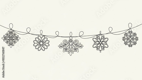 Elegant line art garland featuring intricate snowflake and floral ornaments suspended on a thin wire against a creamy background