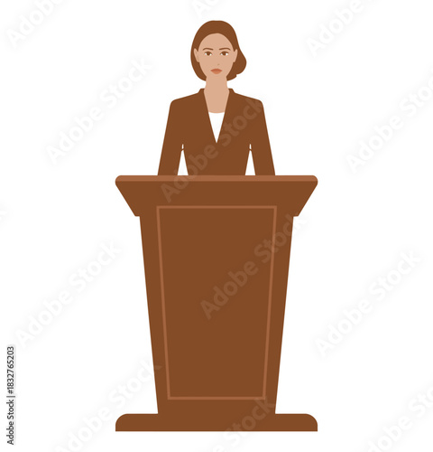 A woman in a suit stands behind a wooden podium, ready to speak.