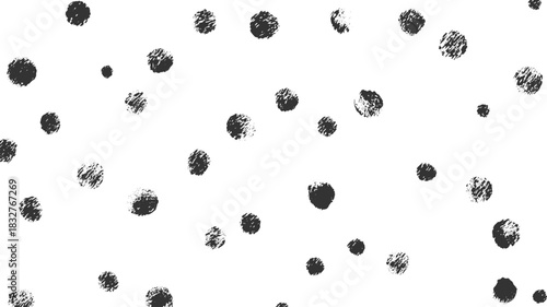 Scattered dark grey textured circles on a white background abstract black