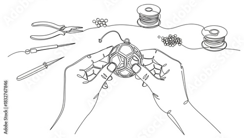 Hands meticulously crafting a delicate spherical ornament using wire beads and specialized tools showcasing the art of jewelry making and diy projects