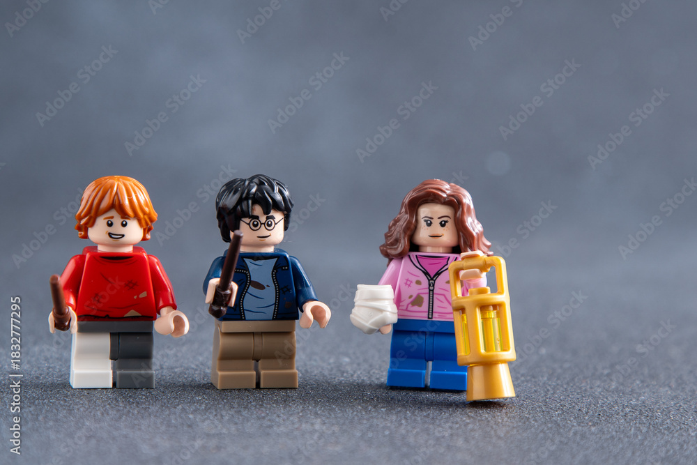 Fototapeta premium Friends forever Ron and Hermione. Lego man Harry Potter mini figures toy bricks. Ukraine, Kyiv - January 17, 2024.