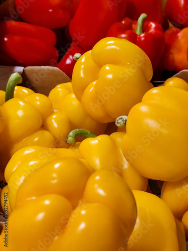 Sweet yellow and red bell peppers. Colorful peppers paprika, natural background. Healthy proper nutrition, diet. Fresh vegetable food. Full frame.