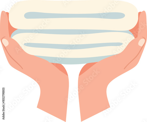 Hands holding stack of clean towels spa or hygiene concept.