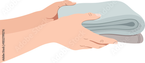 Hands Holding a Stack of Folded Laundry or Towels.