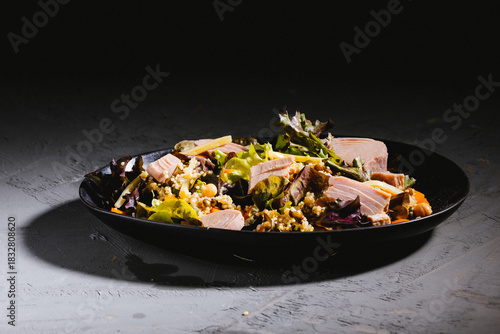 Bowl of salad with tuna steak
