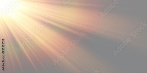 Beautiful sunset with sun rays and orange clouds in the blue sky over the sea at dusk