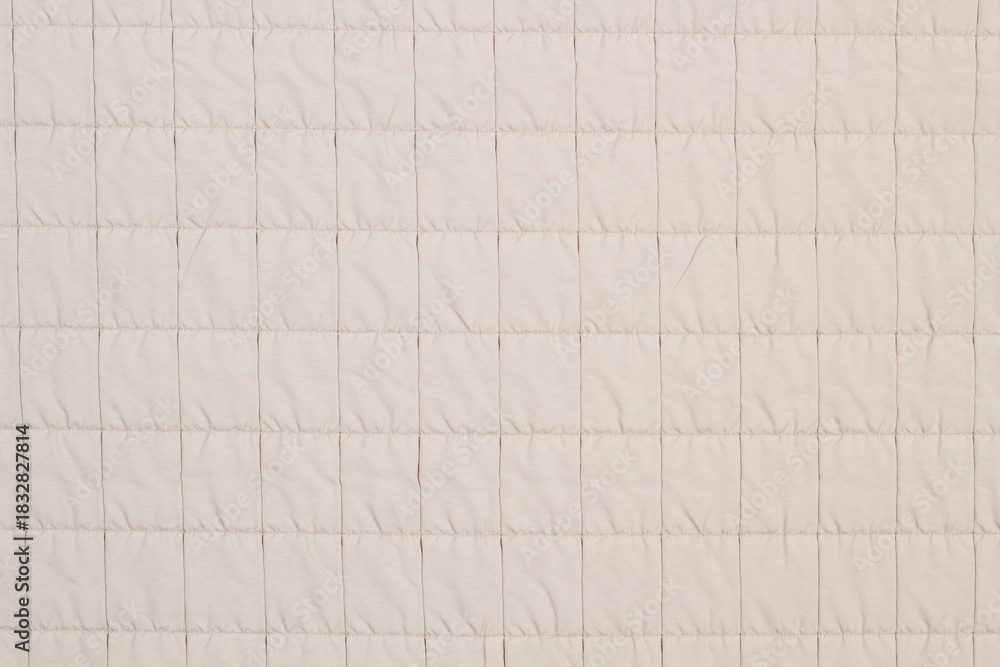 Naklejka premium Quilted fabric. The texture of the blanket. Background to your project