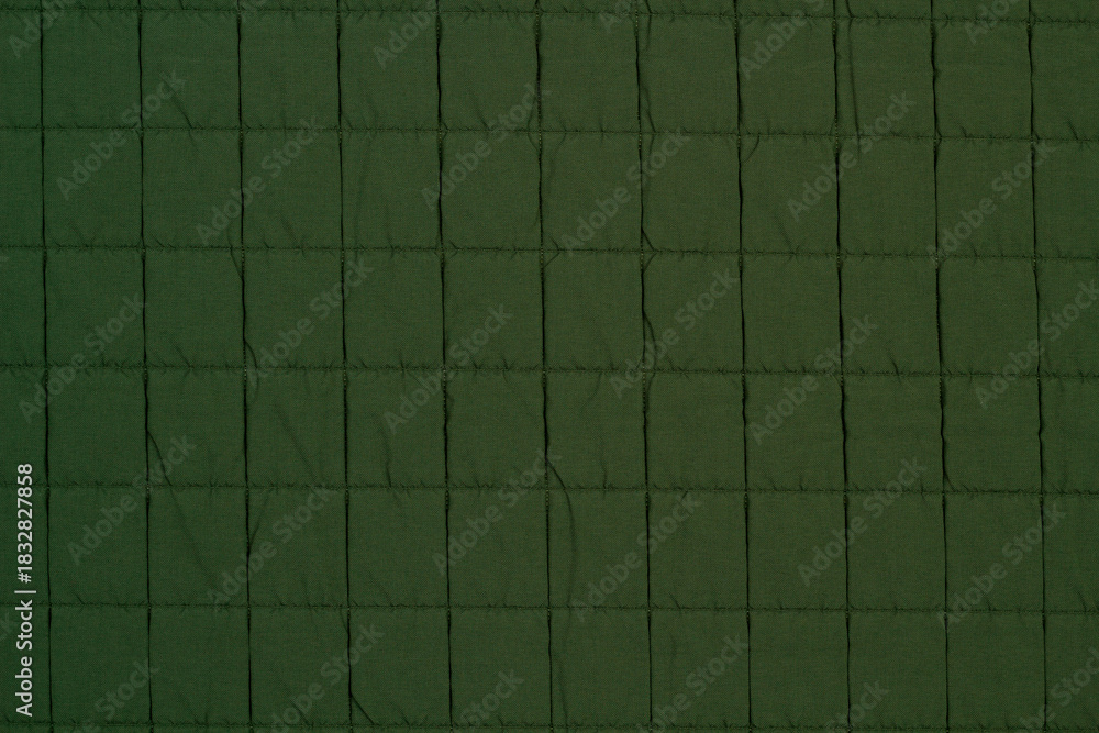 Naklejka premium Quilted fabric. The texture of the blanket. Background to your project