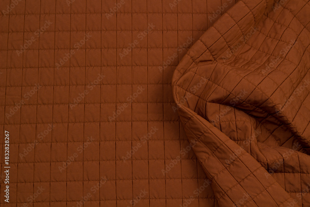 Naklejka premium Quilted fabric. The texture of the blanket. Background to your project