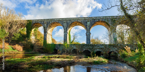 Canvas Print Dramatic seven-arch limestone Durrow Viaduct, historic railway landmark, Waterfo