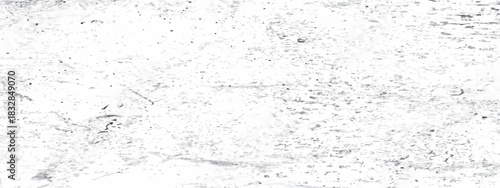 High resolution abstract grunge texture features bold black ink splatters and distressed marks fading into a clean white background, vector illustration.