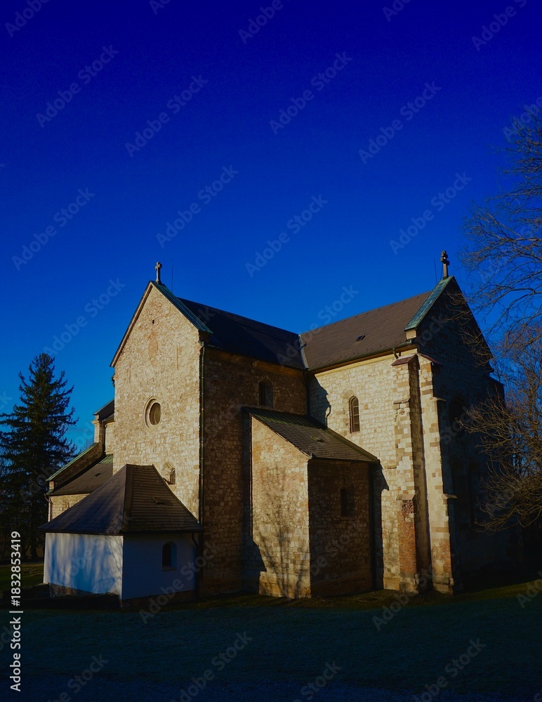 Fototapeta premium Bélapátfalva Cistercian Abbey Hungary’s Only Fully Preserved Romanesque Monastery Church. Situated near the Bél-kő Mountain in Hungary.