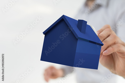 A person's hand holding a s...