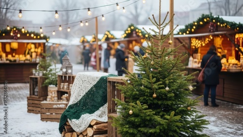 Festive christmas market with wooden stalls and decorated christmas tree in winter